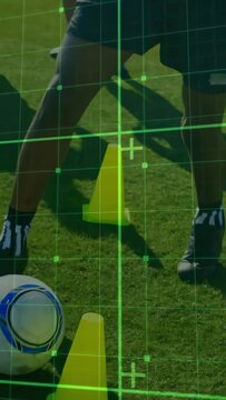 Vertical video: Team running cones on pitch after whistle, green grid highlighting bibs for sports