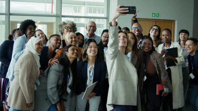 Happy business people taking a selfie