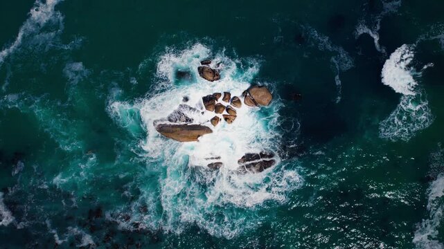 A man dives into the deep blue tropical ocean to explore a vibrant coral reef filled with marine life and colorful fish while snorkeling on a summer island vacation