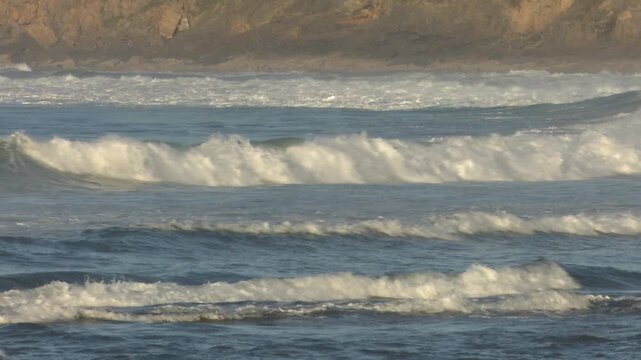 Scenic view of Mundaka on the Cantabrian coast in Bizkaia, famous worldwide for its powerful left-hand surf wave. Coastal town landscape with ocean swell, harbor, and natural surroundings.
