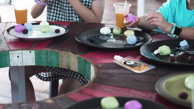 Children learning to make traditional Thai desserts in class