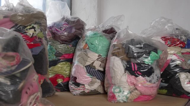 Bulk used clothing in bags for resale business. Second-hand and retail business