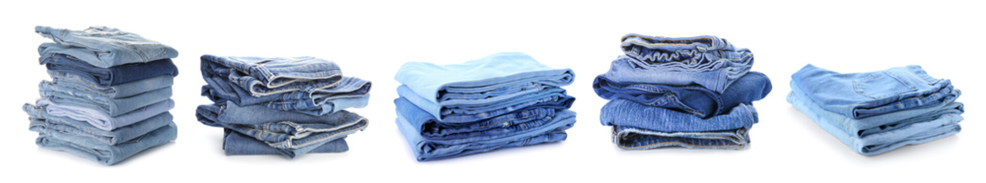 Set of stacked jeans clothes on white background
