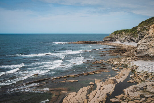 Rocky coast with geological flysch formations.