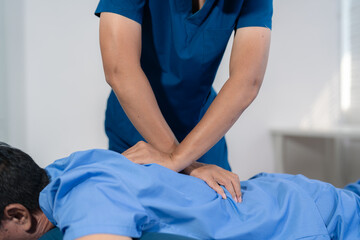 Obraz premium Patient at the physiotherapy doing physical exercises with therapist.