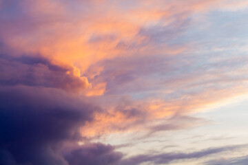 Fototapeta premium Dramatic sunset sky with colorful orange and purple storm clouds