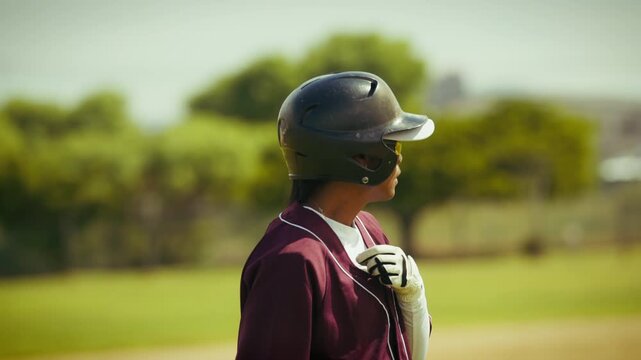 Young baseball player prepares for the game