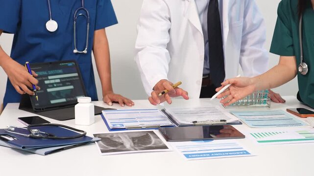Medical team working on digital tablet healthcare doctor technology tablet using computer analyzed the results of medical reports at the hospital