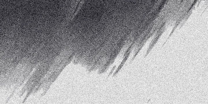 Abstract grayscale texture with a sharp diagonal divide and streaky, granular patterns creating a dramatic contrast for backgrounds and design