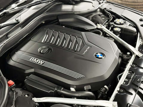 Twin Power Turbo gasoline engine. BMW sport engine or motor under vehicle hood. BMW 8 II (G14, G15, G16) detail of new car engine. Engine motor of BMW car close-up with emblem.