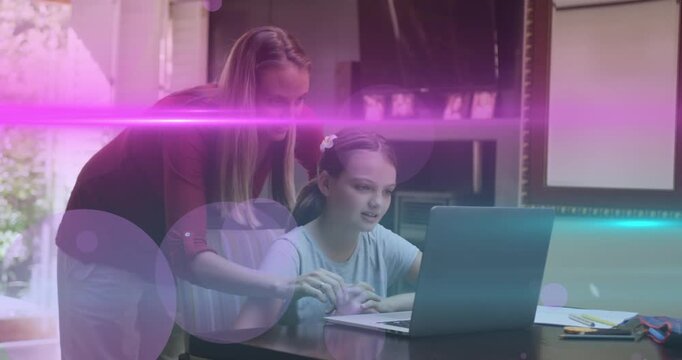 Animation of light and dots moving over happy caucasian mother helping daughter with homework