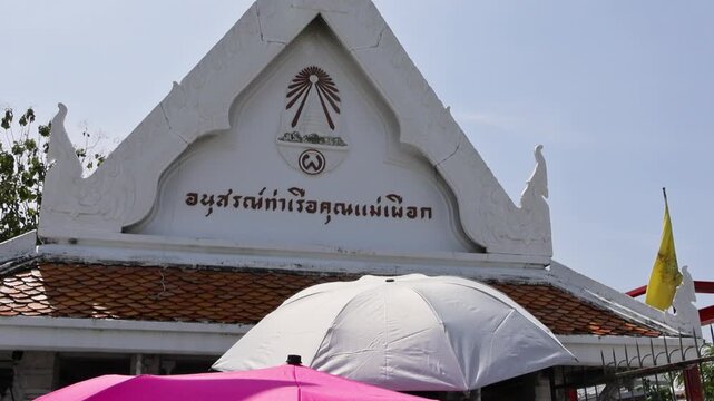 Vibrant Thai temple scene. Colorful temple with umbrellas and festive Wat Arun