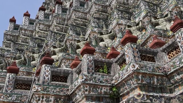 Repeated reliefs and textured layers create rhythmic temple Wat Arun