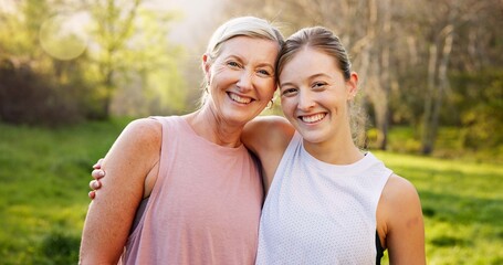 Obraz premium Fitness, portrait and mother with girl in nature for workout, outdoor exercise and wellness for health. Mature mom, daughter or women hug in park for training, sports routine or warm up in Australia