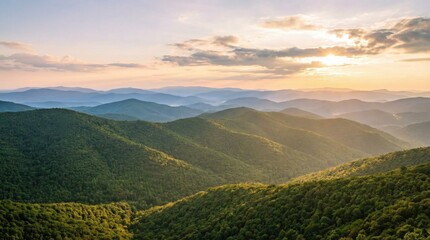Obraz premium Serene mountain range panorama bathed in the warm golden light of a setting sun creating a tranquil and picturesque vista