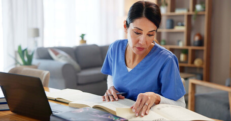 Nurse, woman and studying with textbook by laptop for healthcare research, information or...