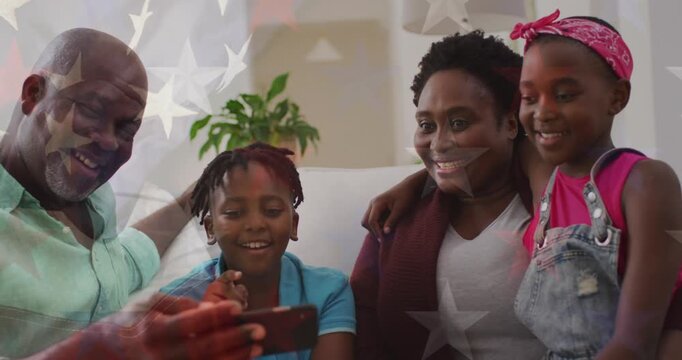 Animation of flag of usa and stars over african american family taking selfies