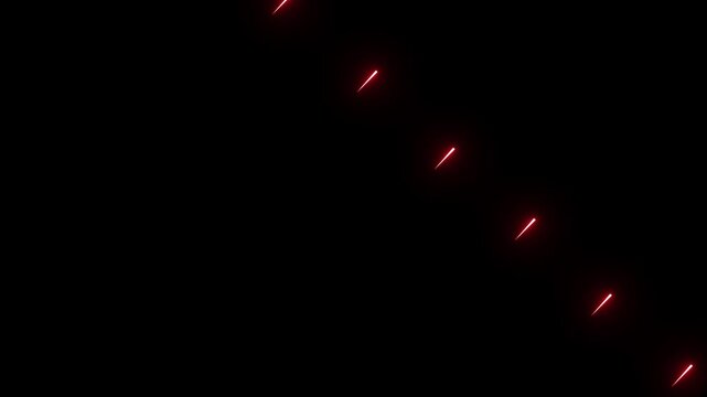 Red light streaks moving across dark screen