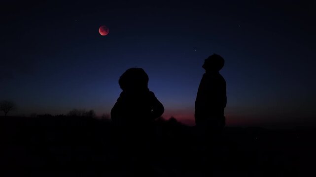 Amateur astro-photographers observing night sky with stars, planets, Moon eclipse and other celestial objects.