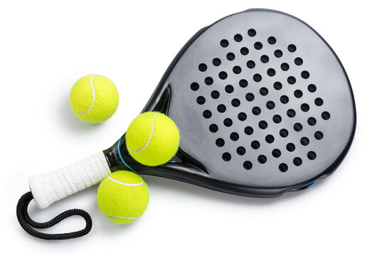 Black padel racket with a white grip and yellow balls for padel isolated on a white background.