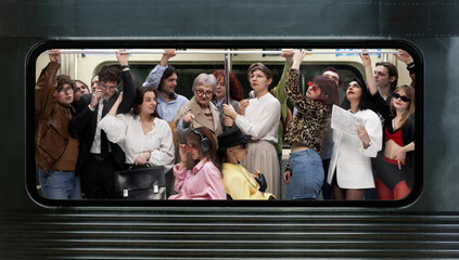 Diverse group of passengers standing crowded inside subway train holding overhead rail in urban...