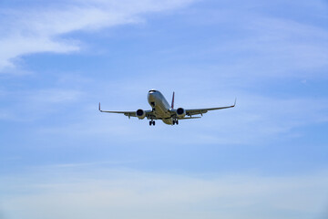 Fototapeta premium Close-up of a commercial airliner approaching for landing