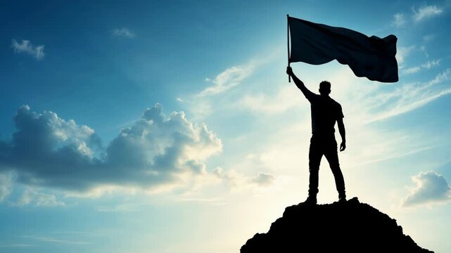 Man standing on a mountain peak, waving a flag against a beautiful sky with clouds and sun