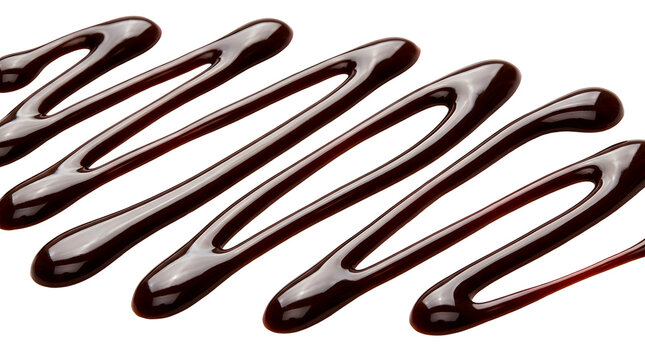 A close-up view of chocolate syrup drizzled in a wavy pattern