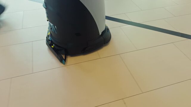 Automated corridor sanitation process. Automatic cleaning system operating quietly to maintain hygiene standards in healthcare corridors