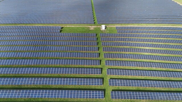Aerial view of rows of solar panels absorb the sun's rays, energy farm generating clean energy, Mansfield, England, United Kingdom.