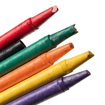 Close up of several used and broken crayons in various vibrant colors