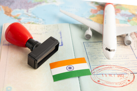 India flag with passport and airplane for travel.