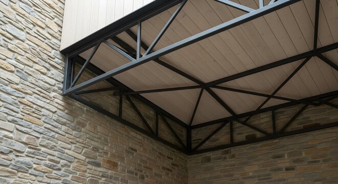 Modern Architectural Structure Featuring an Intricate Steel Framework Supporting a Wooden Balcony Underside Against a Rustic Stone Wall