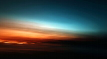 Fototapeta premium Blurred horizon line displays vibrant colors transitioning from deep blue to bright orange tones