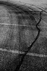 Fototapeta premium Parking Lot with Tire Marks from Cars Peeling Out While Turning Tracks from Traffic Driving