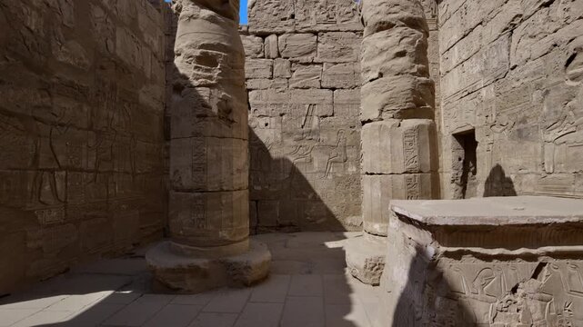 Karnak Temple in Luxor, Egypt. Ancient stone courtyard with massive columns and carved hieroglyphs inside the Karnak Temple, revealing the architectural grandeur of Ancient Egyptian civilization.