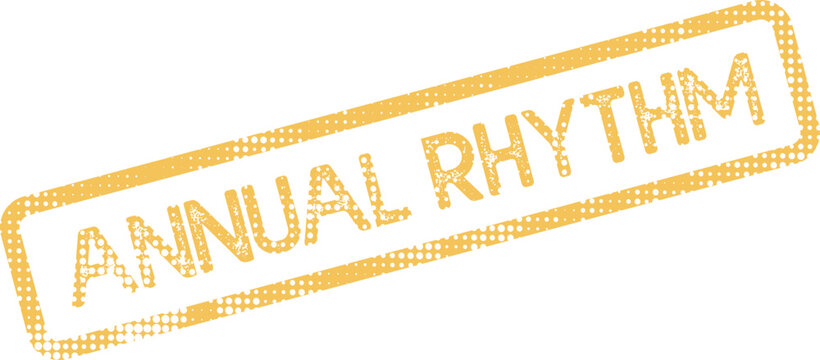Yellow grunge effect rubber stamp for Annual Rhythm text representing recurring patterns