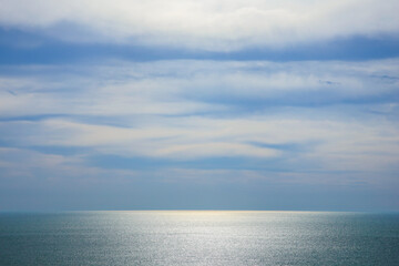 Fototapeta premium Sunlight shining on the turquoise surface of the sea