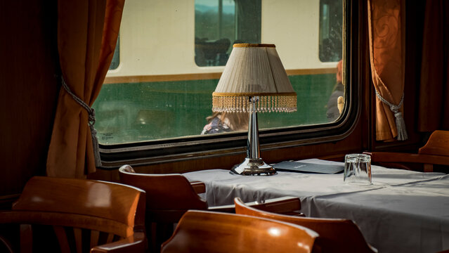 Vintage dining car interior with table lamps