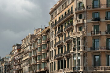 Fototapeta premium Gothic and residential architecture building facades in Barcelona, Spain on a cloudy day