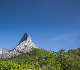 Fototapeta premium Stetinden Norwegian National Mountain in Nordland with Norwegian national flag