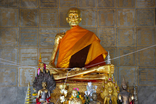 Ancient buddha Luang Pu Dern Hon Ikesaro in antique ubosot for thai people travelers travel visit respect praying in Wat Thung Samo Temple at Phanom Thuan on January 14, 2026 in Kanchanaburi, Thailand
