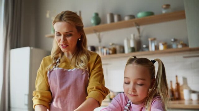 Mom daughter knead dough closeup. Happy woman little girl making holiday cake