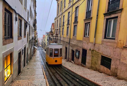An atmospheric and moody photography of the Bica Funicular (Ascensor da Bica)., a funicular railway line in the civil parish of Misericordia, it connects Rua de 