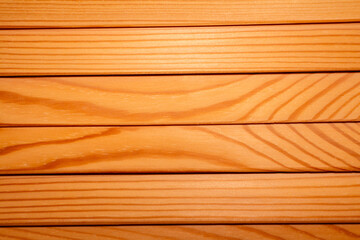 Naklejka premium Close-up of parallel pine wooden slats with natural wood texture. Minimalist furniture detail with warm tones, linear pattern and shallow depth of field.