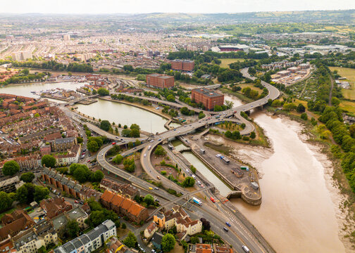 Bristol UK: 28th Jul 2025: The River Avon as it flows into Cumberland Basin, highlighting the blend of urban development and lush greenery in Bristol