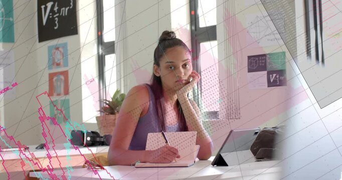Vertical video: Student glancing right writing for class smiling as chart overlay animating on desk