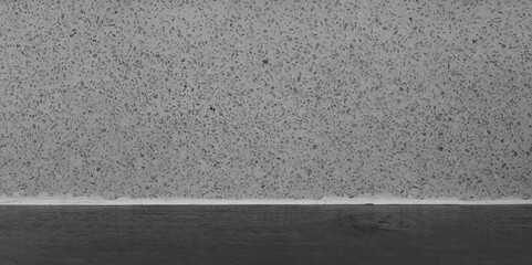 Fototapeta premium Modern Gray Terrazzo Stone Chip Texture Wall with Dark Floor Contrast, Luxury Marble Mosaic Backsplash for Kitchen and Bathroom Interior Design, Polished Speckled Granite Surface Background Pattern.