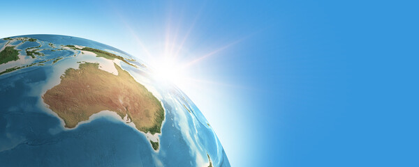 Fototapeta premium Sunrise on detailed satellite cartography of Earth globe from space, Australia continent, blue banner