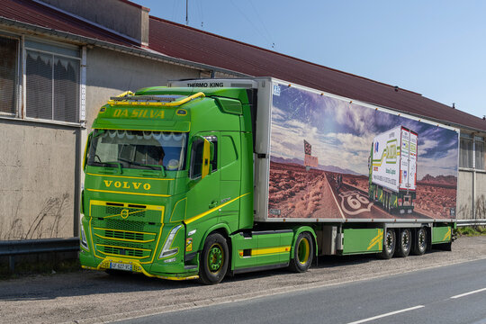 Vand&oelig;uvre-l&egrave;s-Nancy, France - March 18th 2026 : View on a green truck Volvo FH 500 with a refrigerated semi-trailer parked in on a street for a delivery.